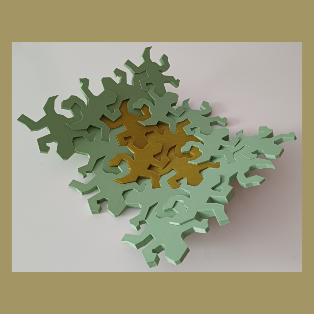 Connected Escher inspired lizards snapped together showing the intended curve used for decoration.