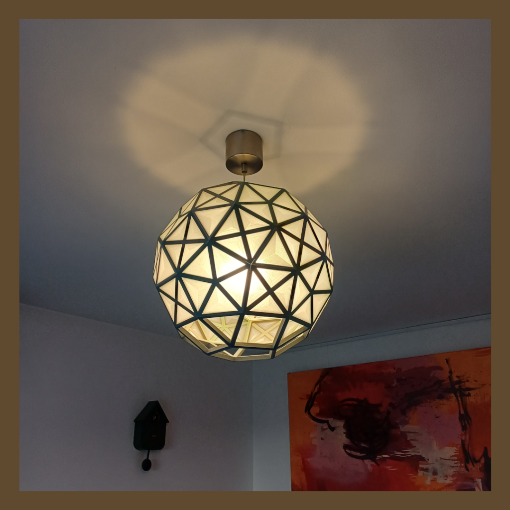 Side view of a hanging lamp shaped like a Rhombicosidodecahedron used for lighting.
