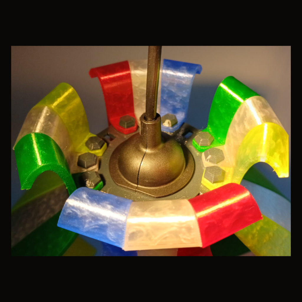 Top view of a colorful segmented hanging lamp used for lighting.