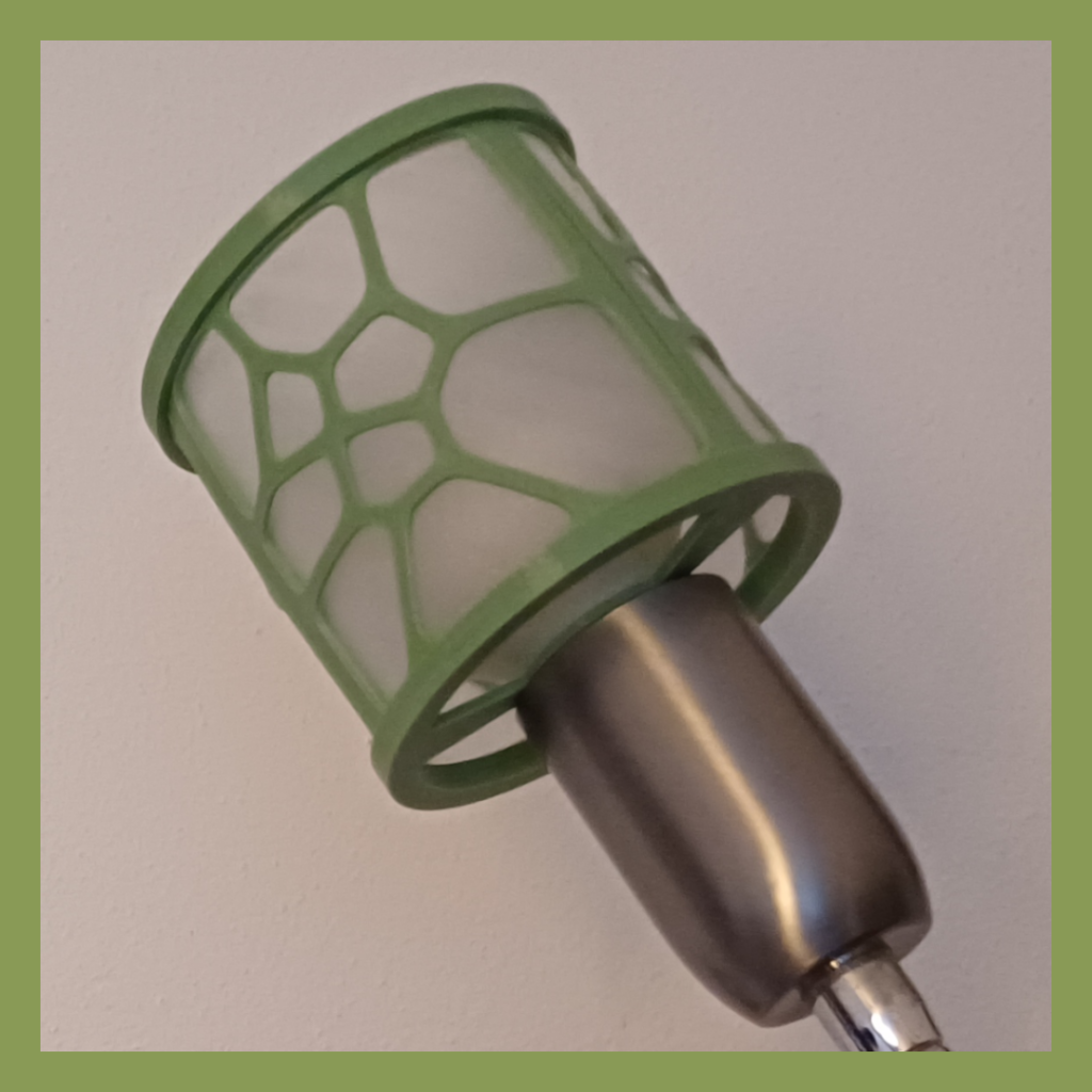 Detailed side view of a Voronoi diagram based shade of a wall lamp used for lighting.