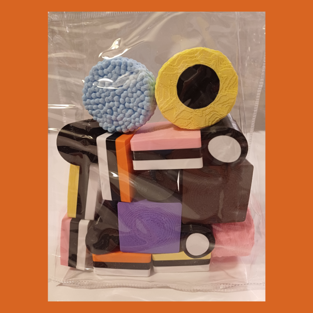 Front view of double sized liquorice allsorts in a transparent bag used for decoration.